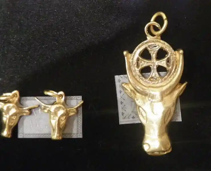 A cross inside the solar disc in between the horns of Apis an Egyptian bull deity A cross inside the solar disc in between the horns of Apis an Egyptian bull deity